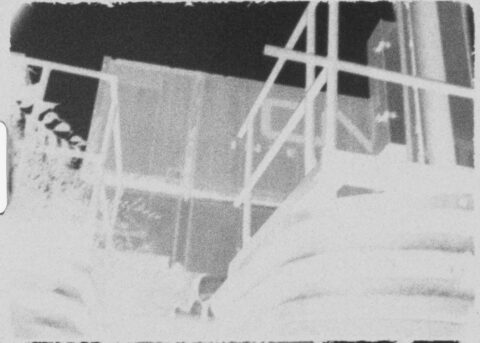 grainy super 8 image of industrial architecture