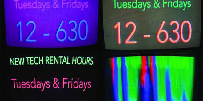 An image of 4 CRT monitors, all showing the text NEW TECH RENTAL HOURS, TUESDAYS & FRIDAYS, 12 - 630, all in various colours