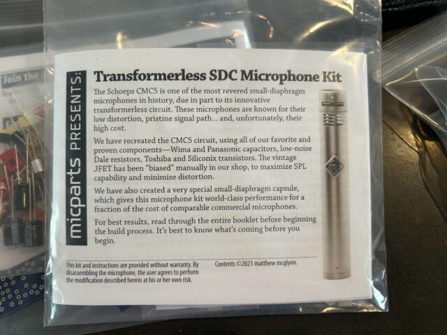A pamphlet by MicParts with information about a transformerless small condenser microphone, featuring a picture of the mic