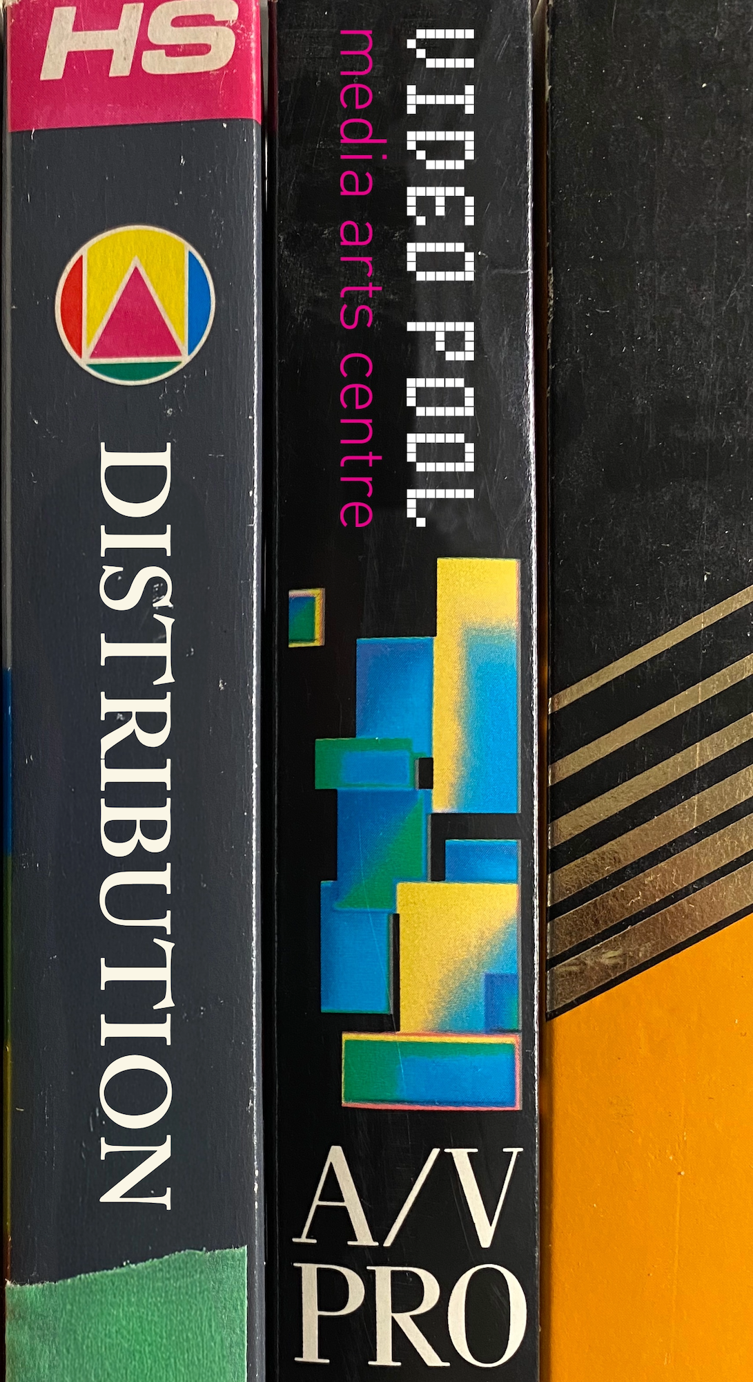 vhs tapes with the text "distribution" and "video pool media arts centre"