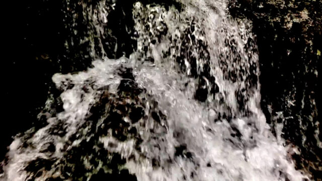 A close-up of a gushing waterfall